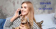 Cats – Indoors or Outdoors? Picture of a caucasian female reclined and holding a brown striped cat.